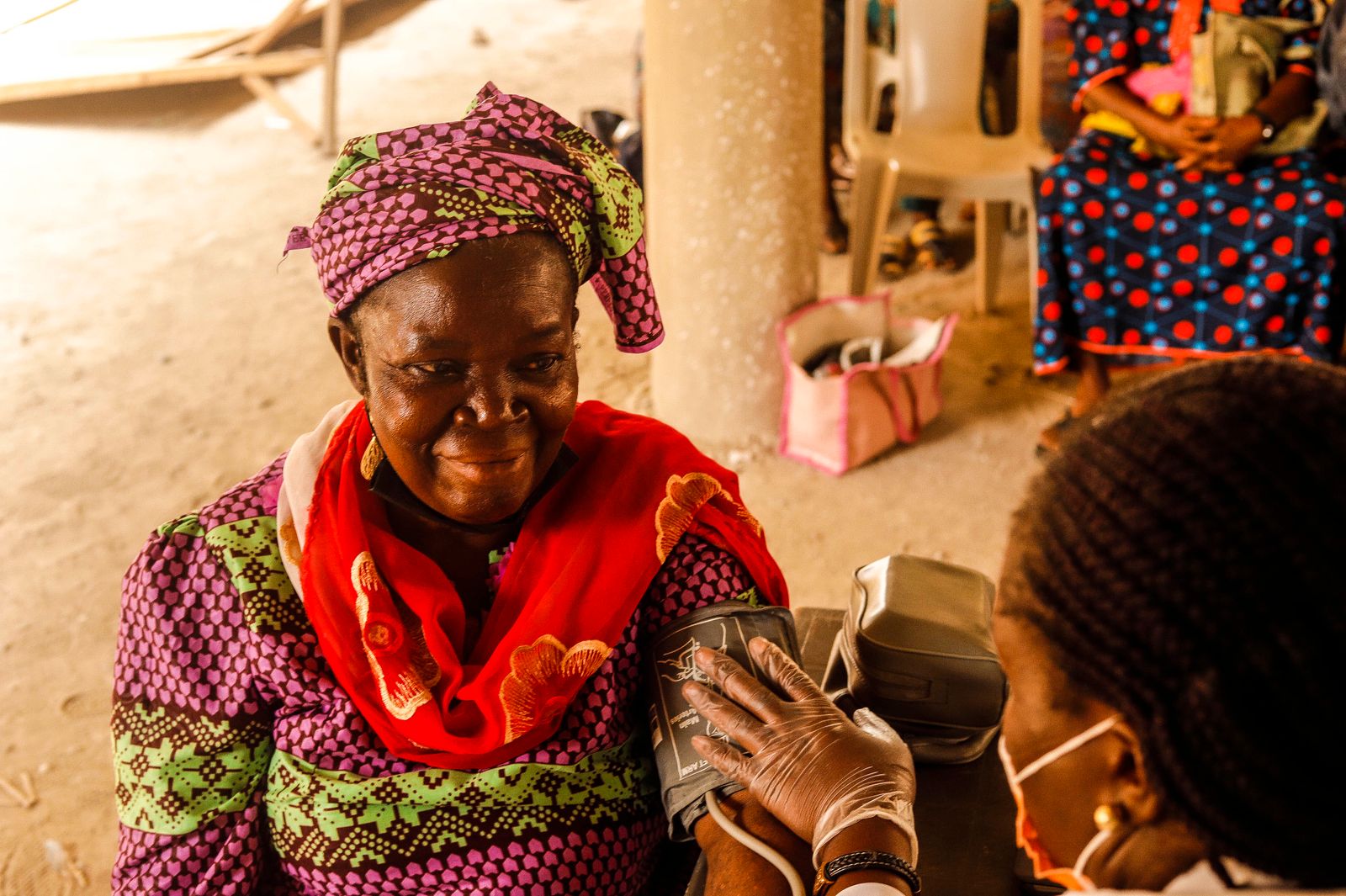 An older woman having her blood pressure checked